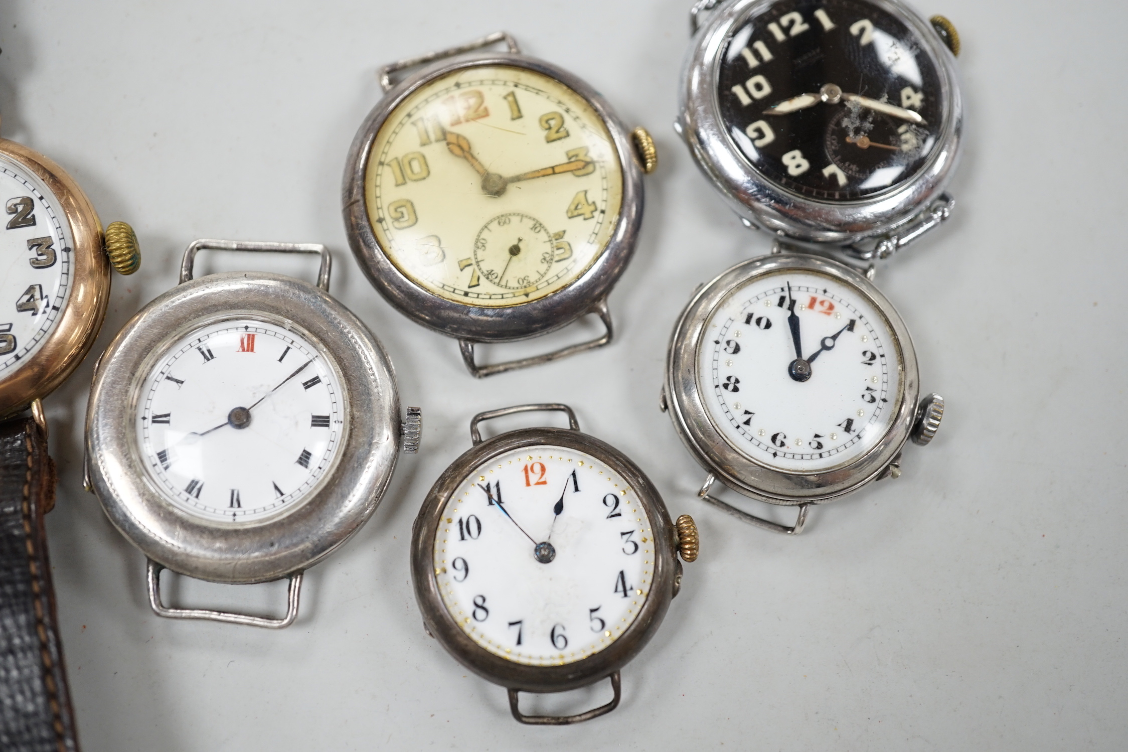 A gentleman's early 20th century 9ct gold manual wind wrist watch and six other wrist watches including silver.